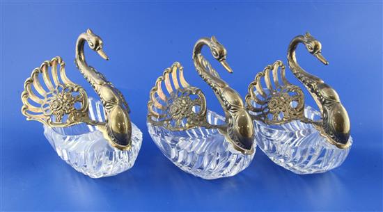 A matched set of three modern repousse silver mounted cut glass sweetmeat dishes modelled as swans, height 6in.